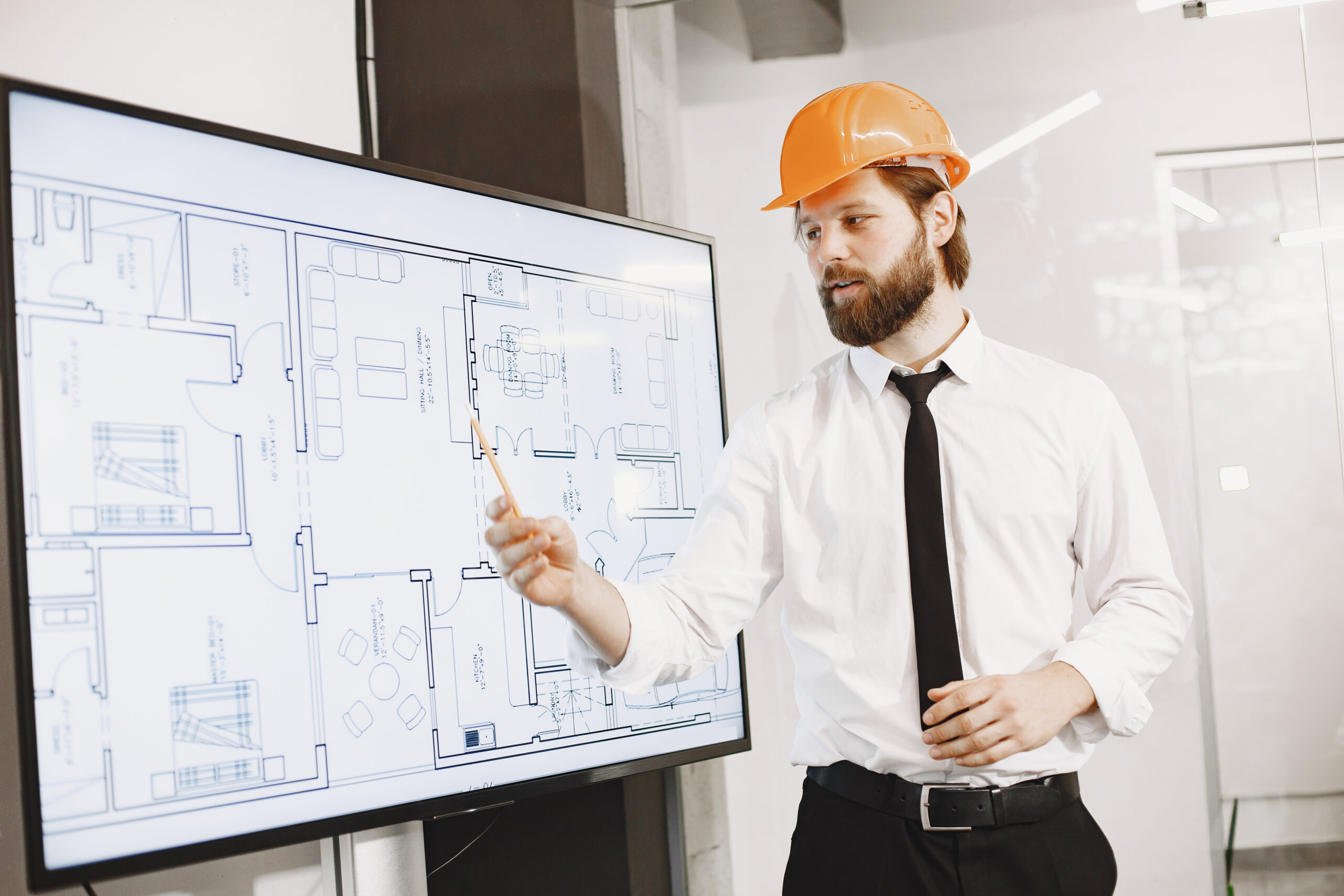 architect engineer man shows plan building tv screen scaled