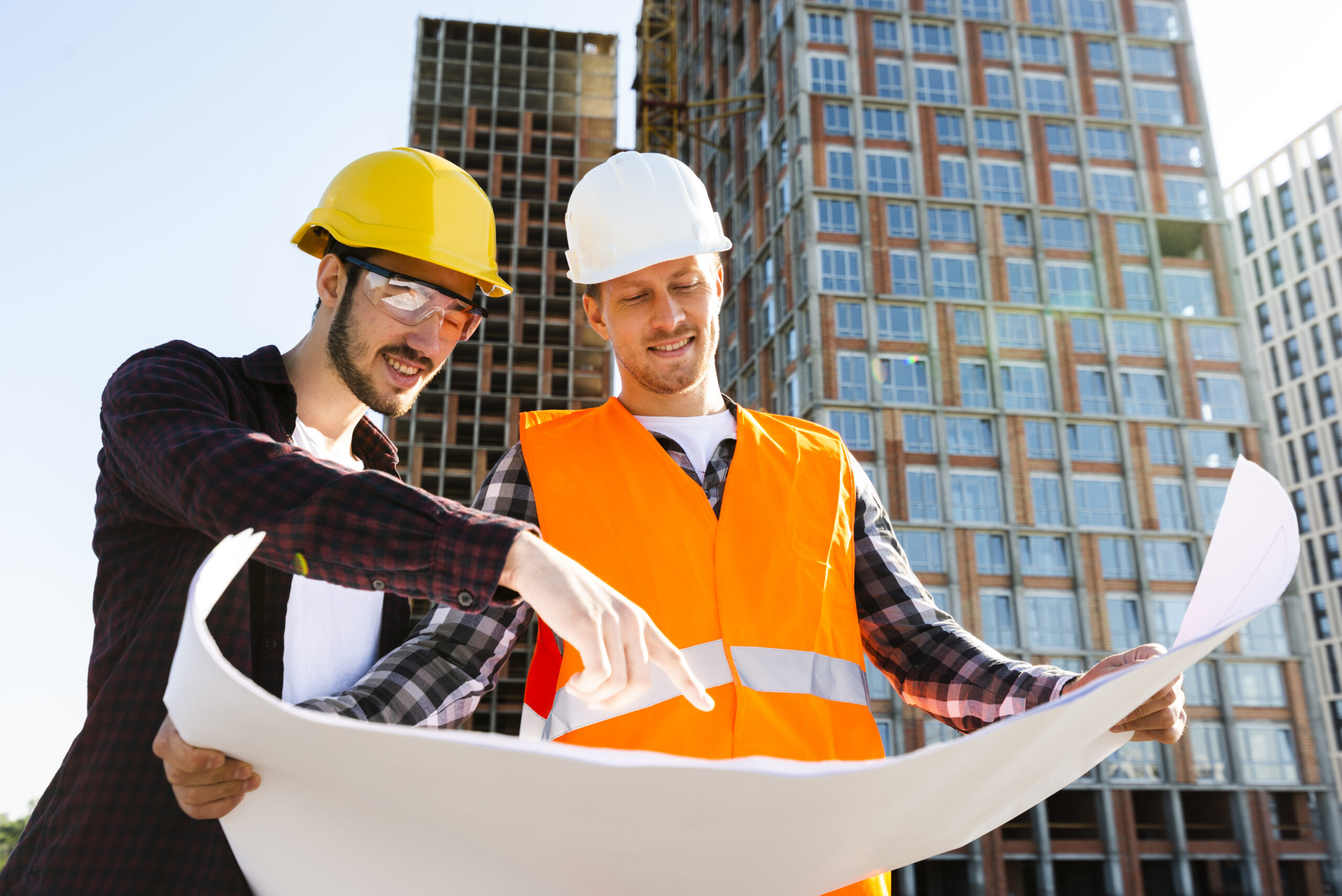 medium shot low angle view engineer architect supervising construction scaled